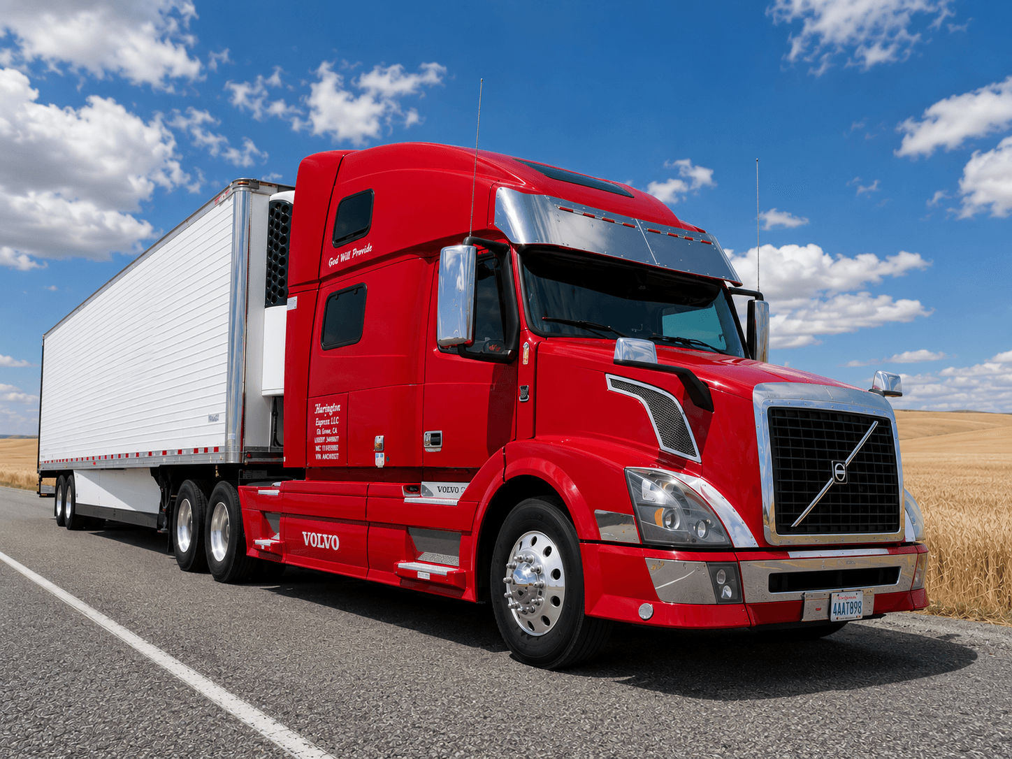 Red Volvo truck connected to a refrigerated trailer